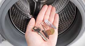 Check pockets for coins and sharp objects